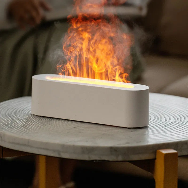 White square DQ709 flame effect aroma diffuser and ultrasonic cool mist humidifier on a table.