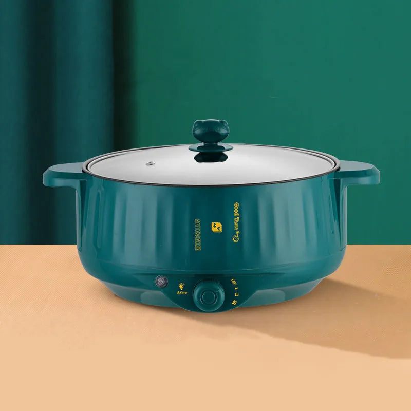 Stainless steel electric pot with non-stick interior showing steaming, frying, boiling, and stewing functions