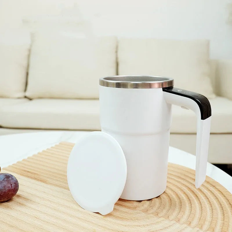 White electric stirring mug with LCD temperature display and magnetic stirrer base