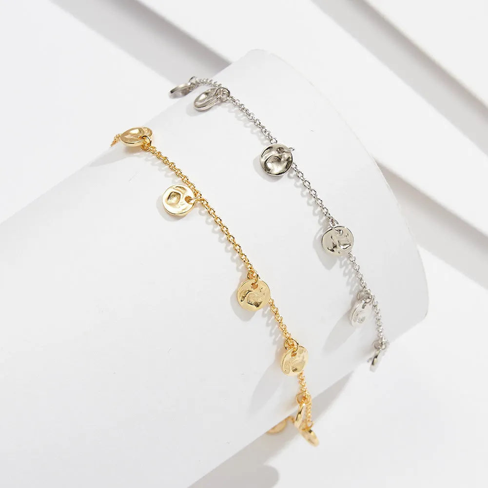 S925 sterling silver women's anklet with round geometric charm on adjustable chain.