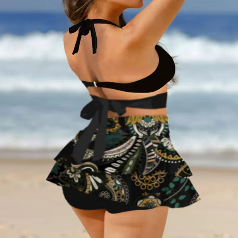Women's purple bikini swimsuit with high-waisted briefs, backless design, lace-up top, and matching skirt for swimming.