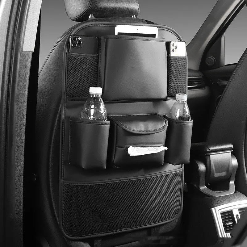 Leather car seat back storage bag in brown colour hanging over vehicle seat