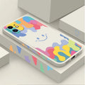 White TPU phone case with rainbow smiley face design and attached black lanyard for Apple iPhone.