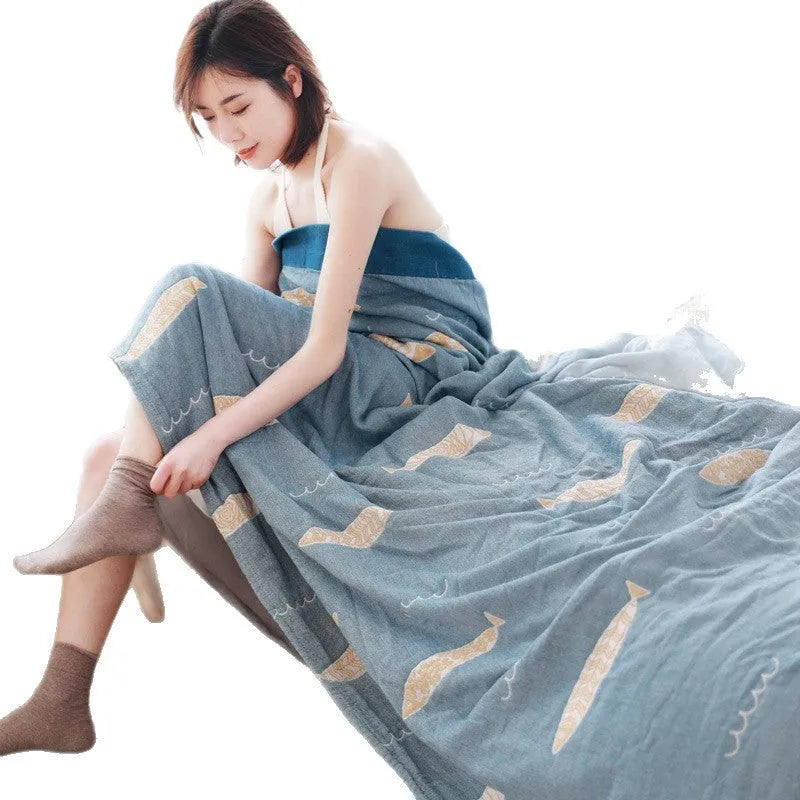 Five-layer gauze bed sheet blanket in Roulette Wheel Blue pattern on a bed