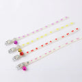 Luminous cat collar with a metal bell on an adjustable 29cm silicone strap, showing paw print design.