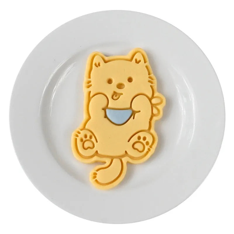 Three-dimensional press mould for creating puppy-shaped biscuits with seven design options including birthday hats
