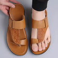 Men's simple beach slippers in cowhide with rubber sole, shown in light brown colour