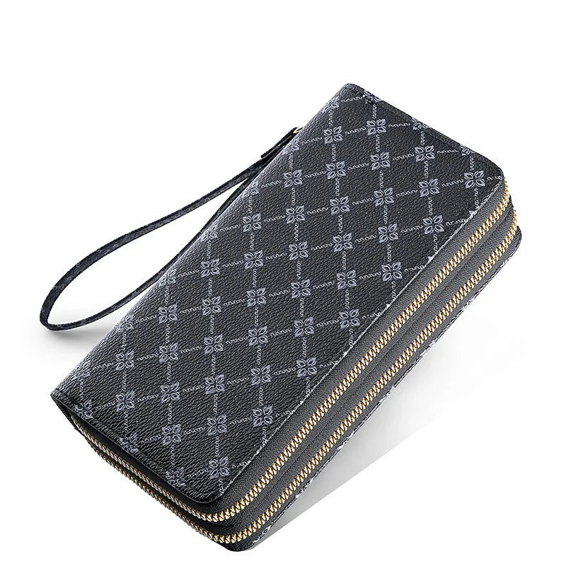 Retro style long wallet clutch in PU leather with a print design, shown in black colour.