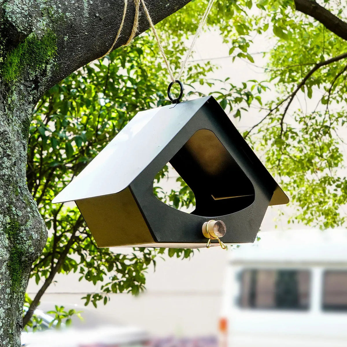 European-style modern iron bird house with anti-rain shelter in garden setting