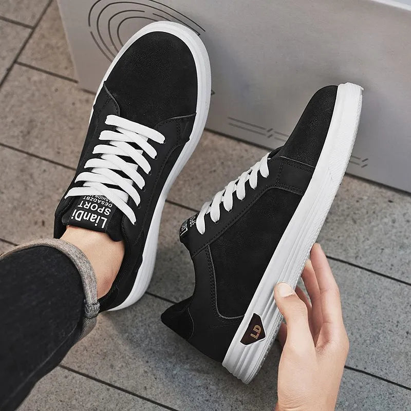 Men's black snake pattern PU leather casual sneakers with round toe and rubber sole on a white background.