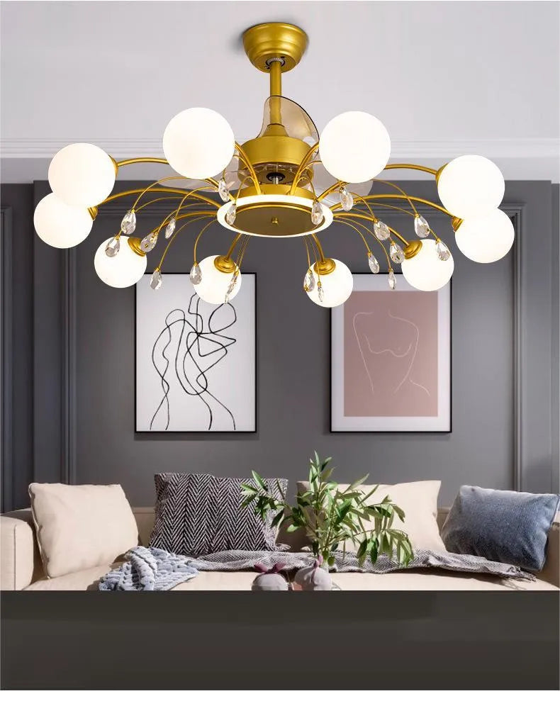 Gold ceiling fan lamp with metal blades and acrylic lampshade, showing remote control for tri-colour lighting and airflow adjustment