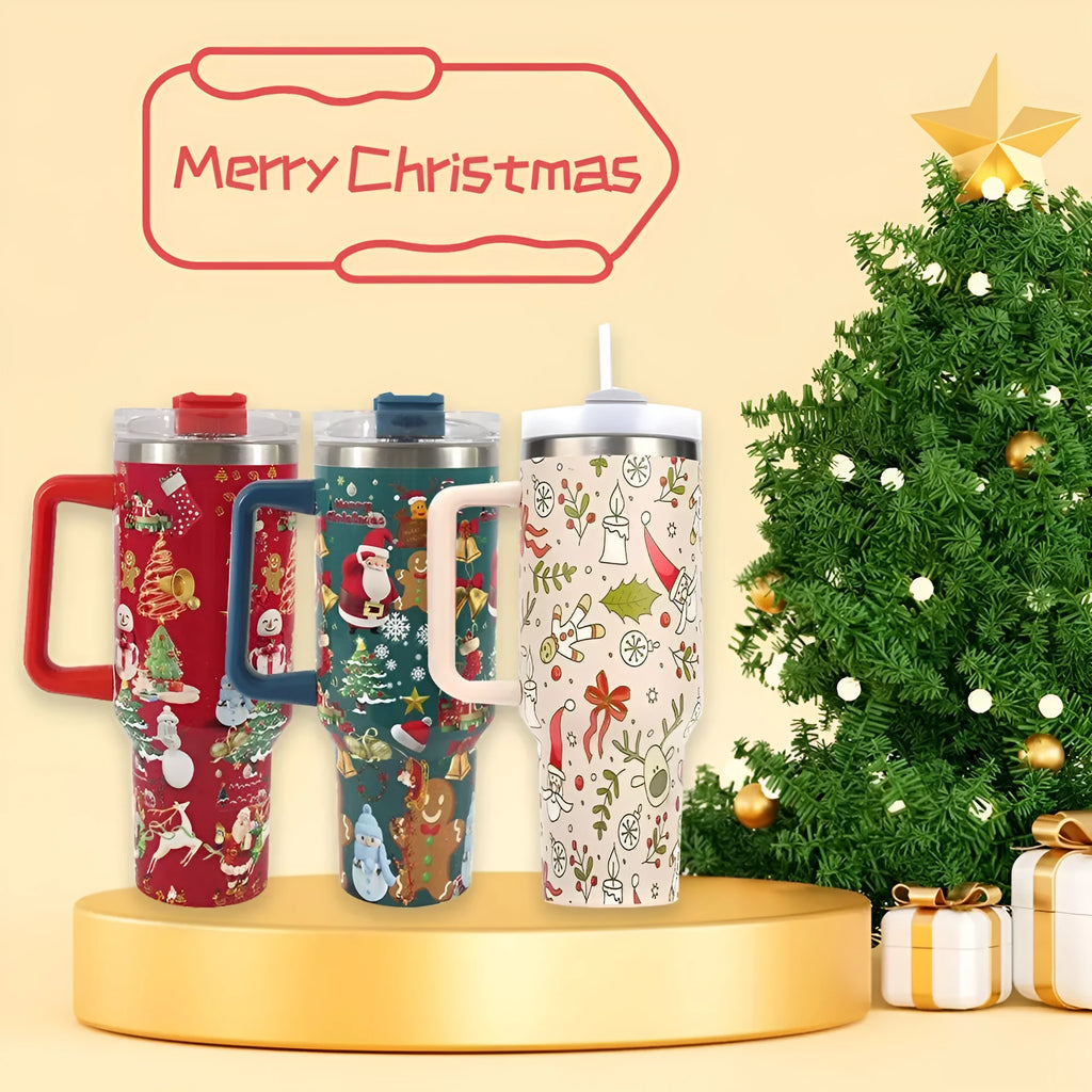 A large stainless steel travel mug with a handle, straw, and Christmas pattern, shown next to its leak-proof lid.