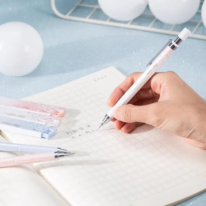 Simplified 0.5mm cartoon automatic pencil set showing three mechanical pencils and HB refill boxes