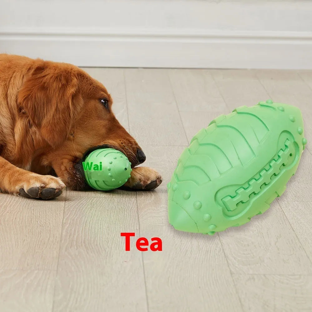 Light green rubber rugby ball dog toy with bite-resistant texture for interactive play and teeth cleaning.