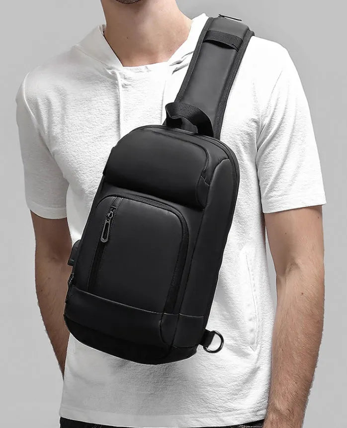 Black outdoor shoulder bag with air cushion strap and internal organisation compartments