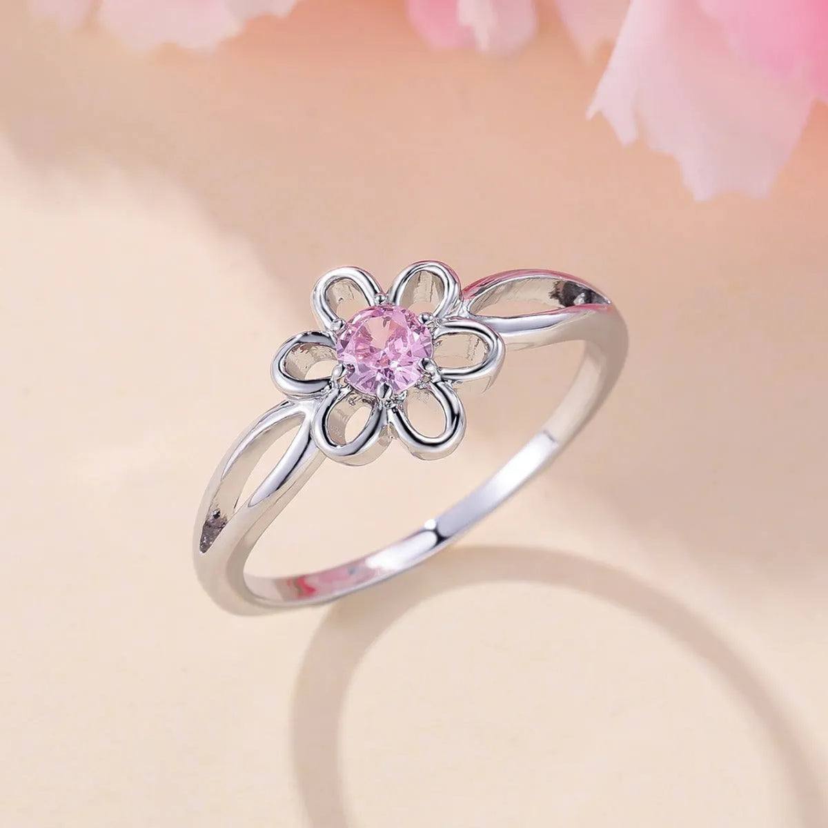 Women's copper fashion ring with hollowed flower design in platinum pink diamond colour