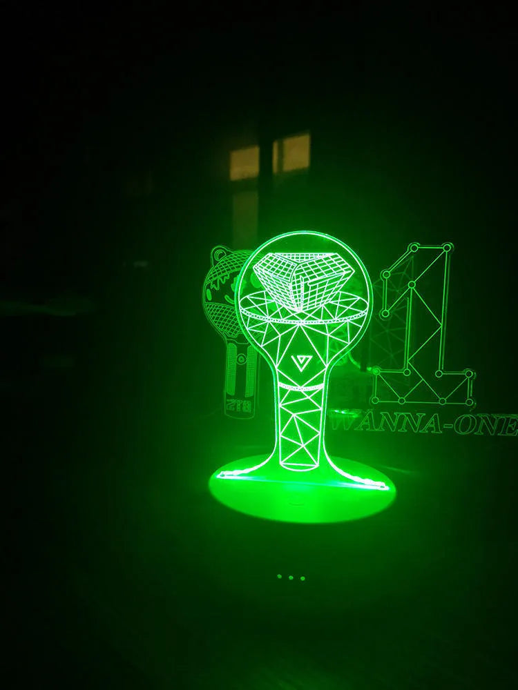 BTS-themed acrylic light-up display stand holding BTS Light 101 Tower Gem collectible