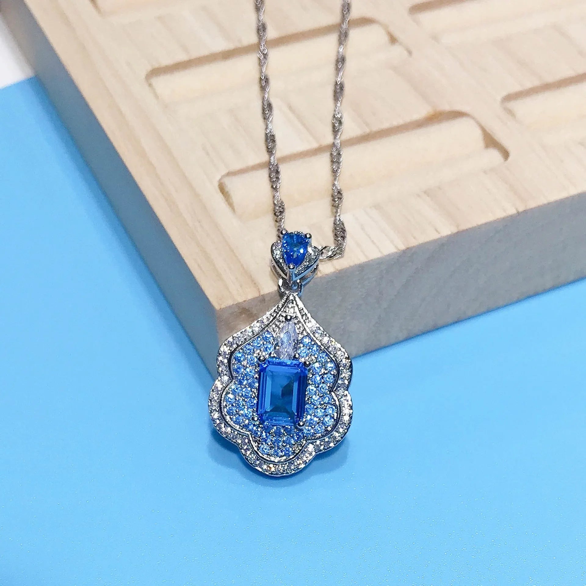 Sea blue geometric copper pendant charm with aquamarine topaz colour for DIY jewellery