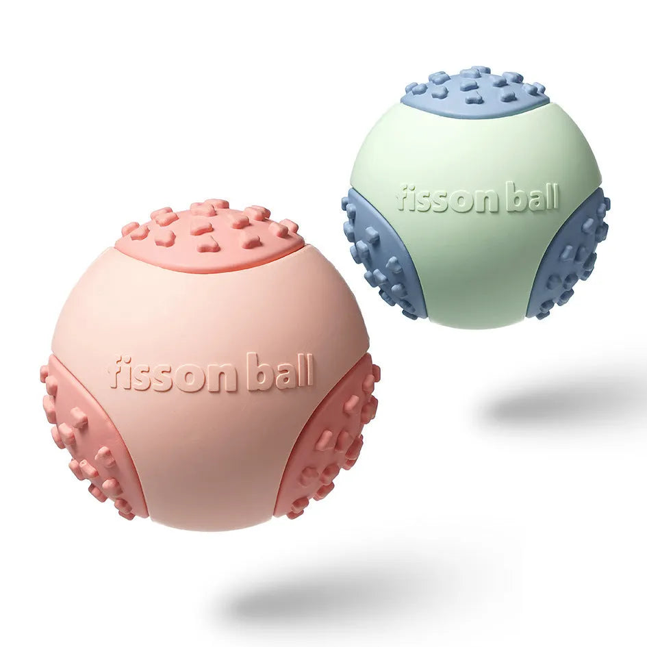 Green and pink rolling ball dog toy with 64mm diameter for small to medium dogs