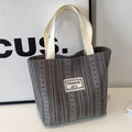 Japanese style large capacity corduroy handbag in dark brown, shown front view.