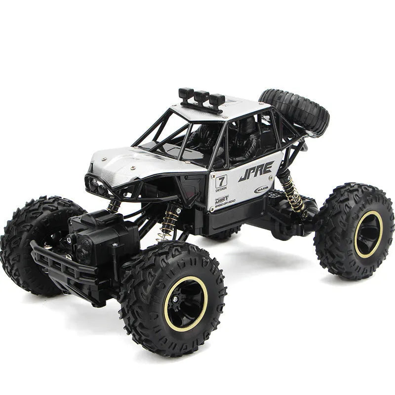 Black or silver remote control climbing car with 2.4G wireless remote on rough terrain