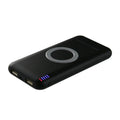 Black B100 wireless charging power bank on a wooden surface, showing USB port and charging indicator.