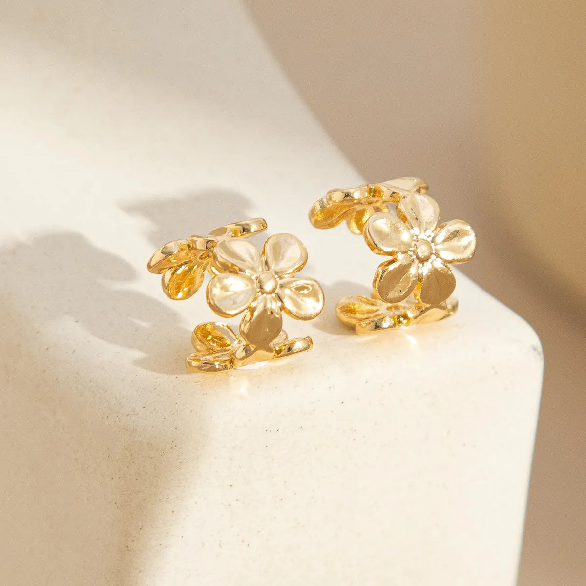 Gold-toned starfish and scallop eardrop earrings with conch designs and animal modelling on alloy construction