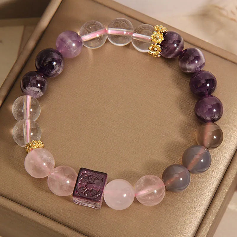 Women's purple amethyst crystal bracelet with rhinestone accents showing 10mm stones