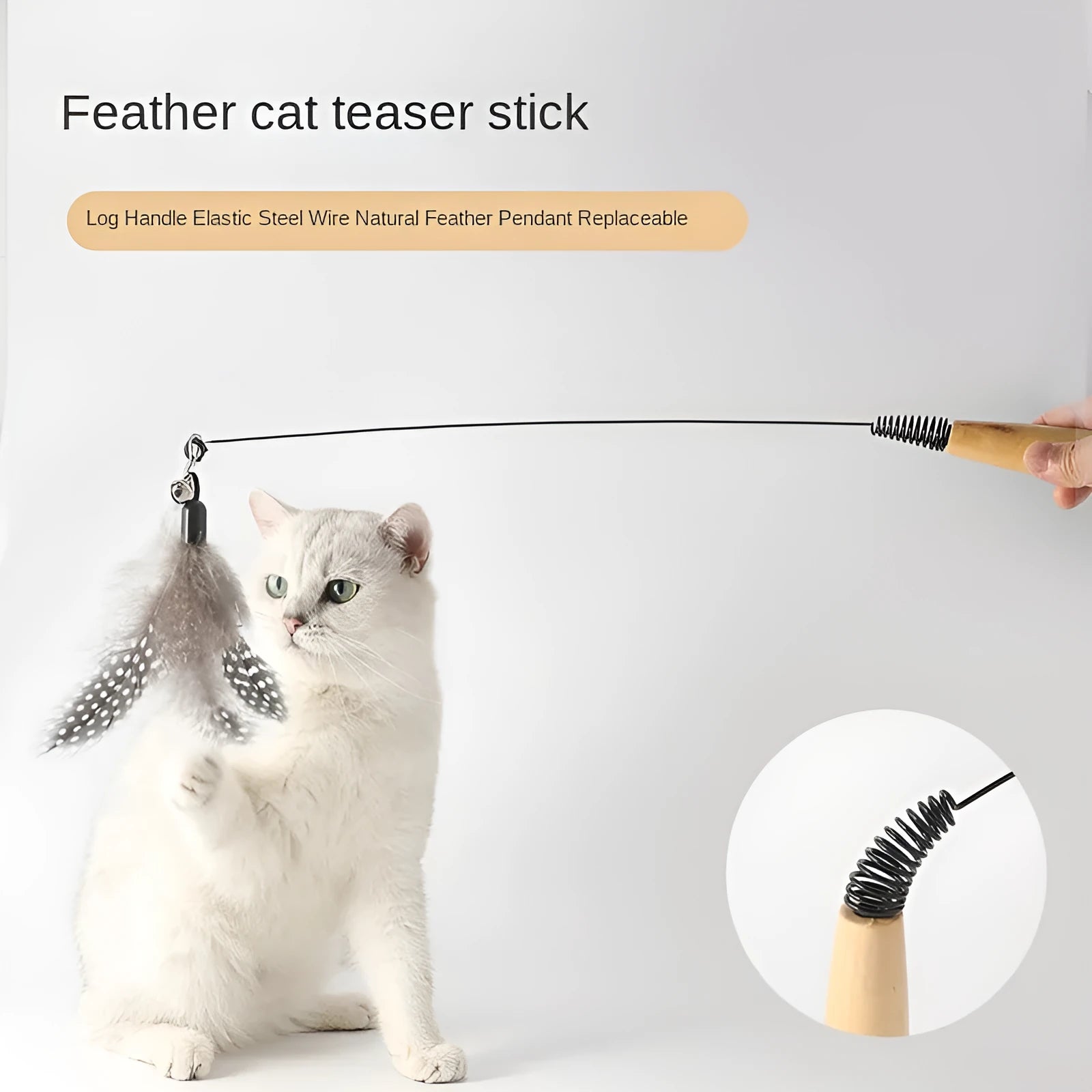 Cat teasing stick with wooden handle, flexible metal spring, and feather bell replacement head