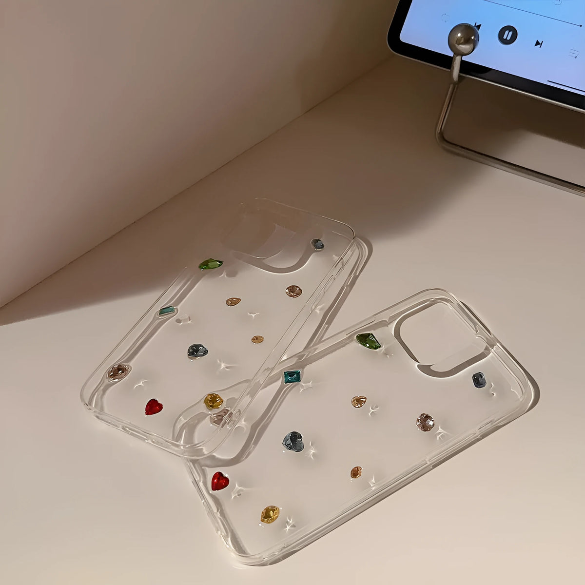 Crystal epoxy iPhone case with colourful rhinestones and love heart design on transparent TPU cover