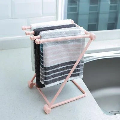 Foldable plastic dishcloth shelf in light blue with vertical towel storage
