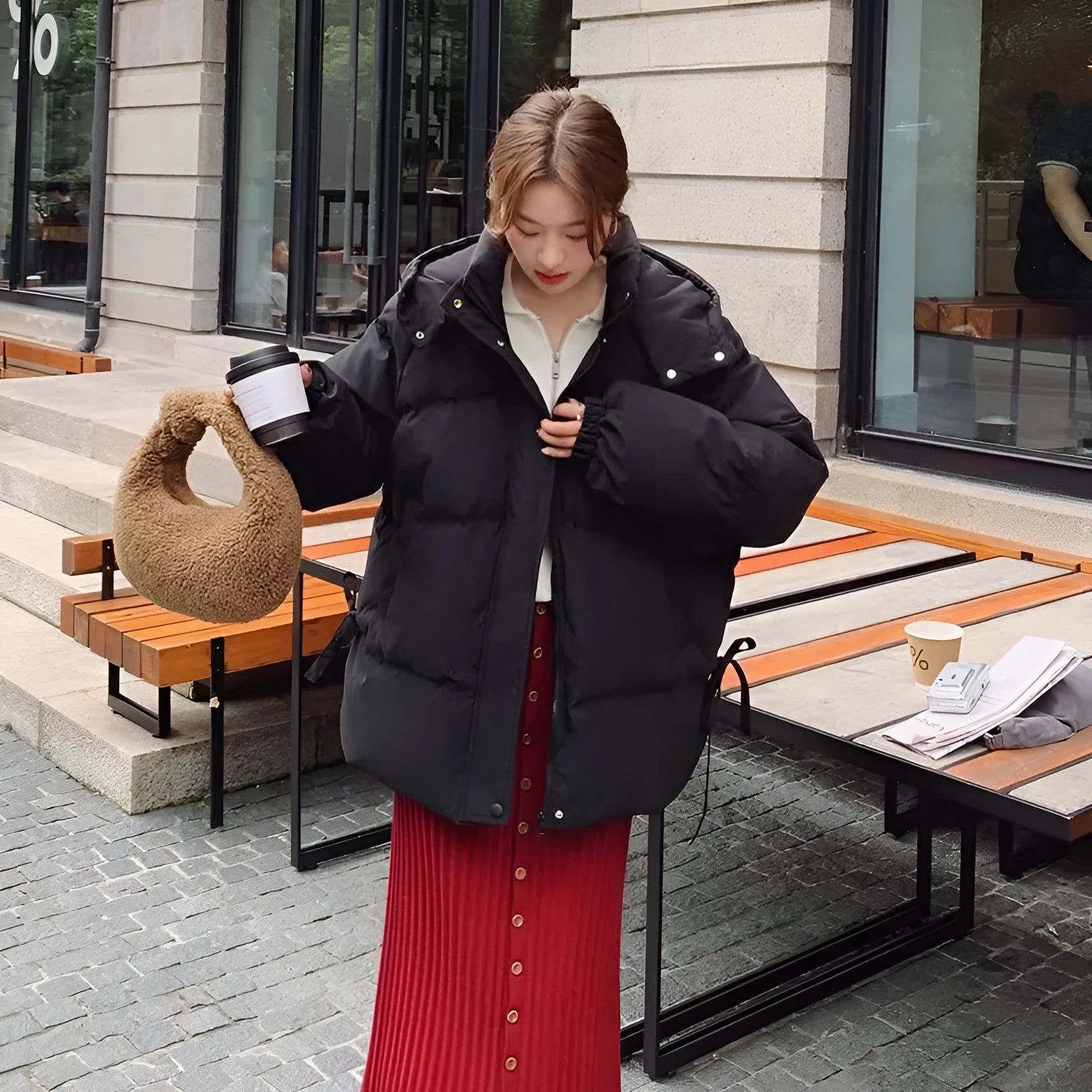 Milky white women's sleeveless loose cotton-padded jacket with princess sleeves on a hanger.