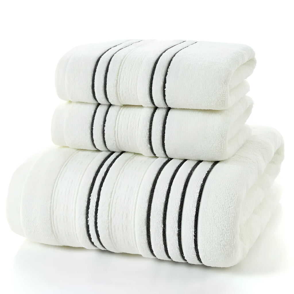 A set of one large bath towel and two smaller hand towels in a neutral colour, made from 100% cotton.