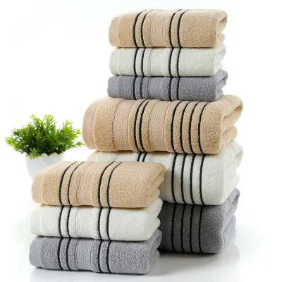 A set of one large bath towel and two smaller hand towels in a neutral colour, made from 100% cotton.