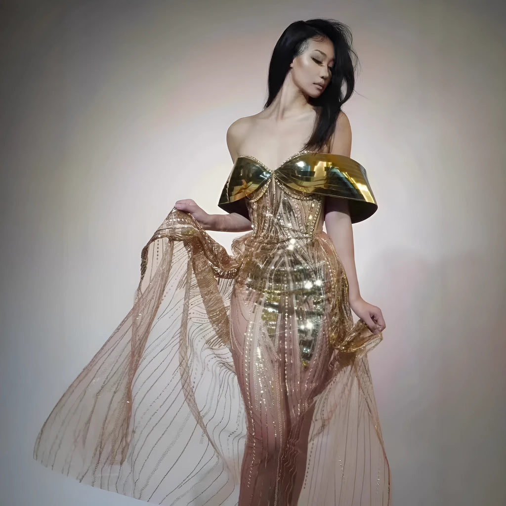 Gold strapless sequin dress with tulle overlay and a long split skirt