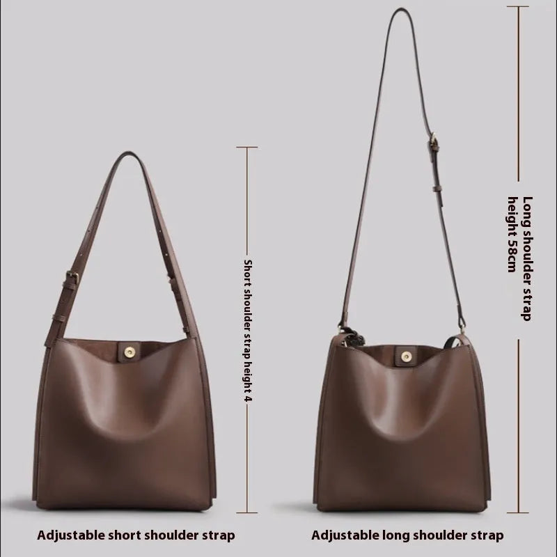 Genuine leather women's commuter bag in brown bucket design with organised internal compartments