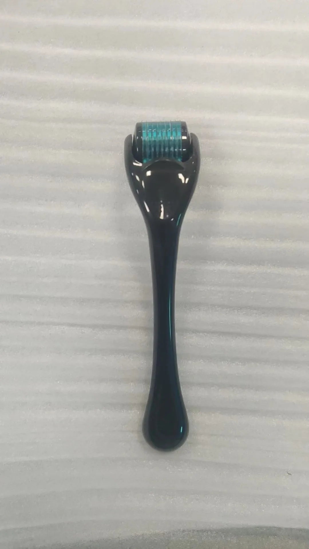 540 micro needle roller with PC handle and coloured wheel showing needle configuration for skin treatment