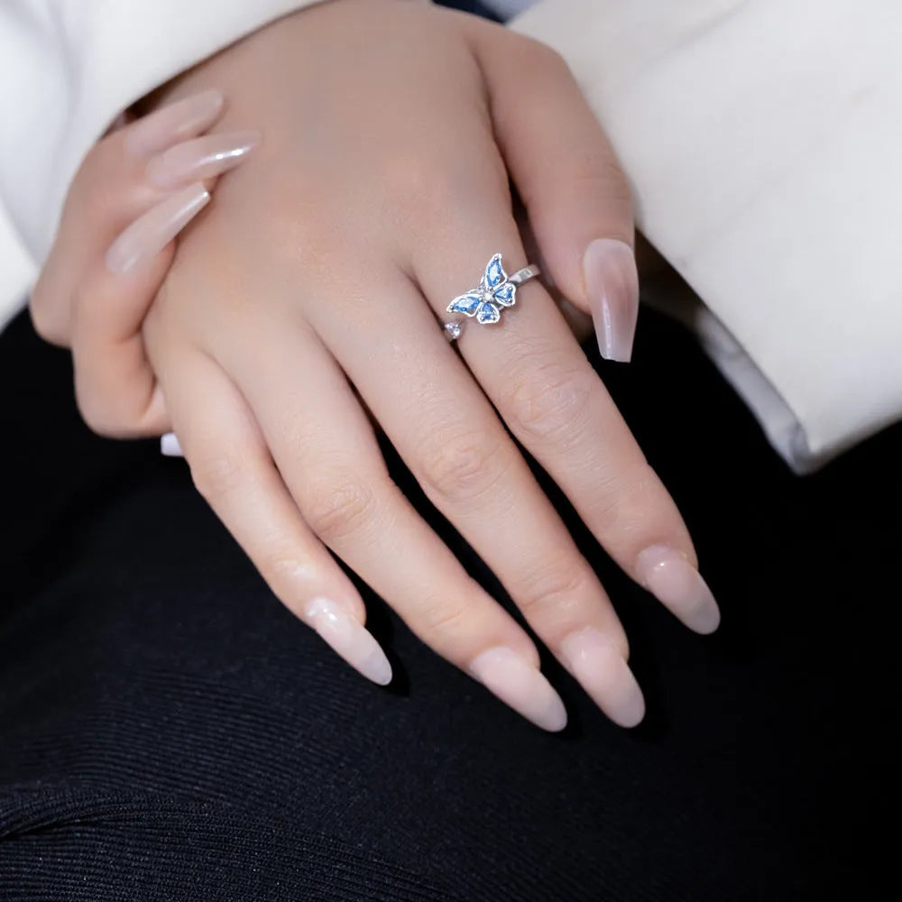 Adjustable butterfly ring in electroplated copper, available in white gold or yellow gold with blue or pink diamond finish