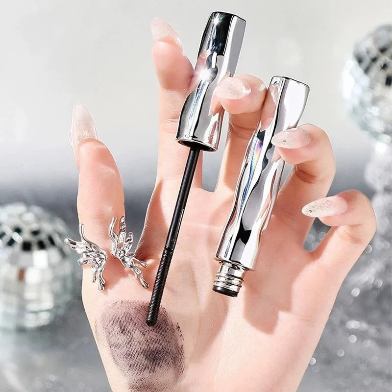 Waterproof black and brown steel tube mascara with optional eyelash curler.