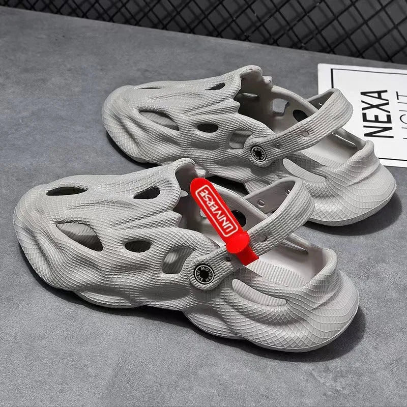 Grey closed toe EVA coconut slippers for beach wear on a sandy background