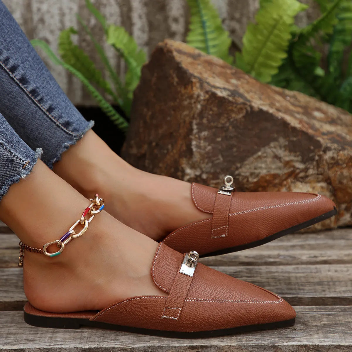 Light brown women's pointed-toe semi-slippers with a low heel and rubber sole.