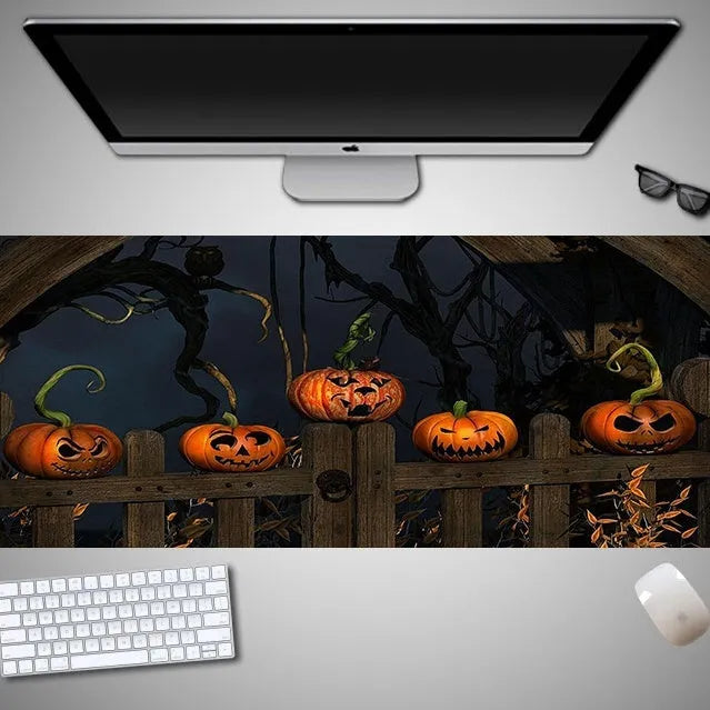 Oversized Halloween-themed mouse pad on desk with non-slip rubber cloth base and large surface area