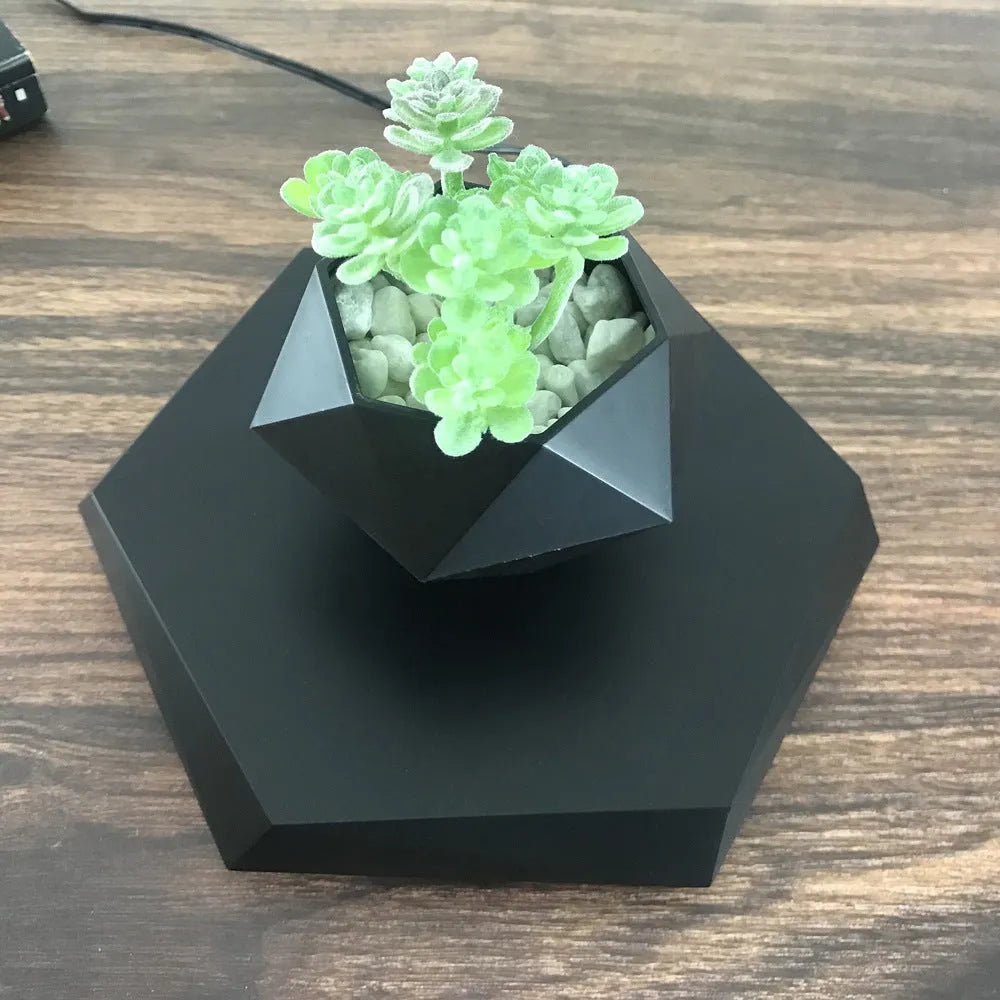Hexagonal wood grain magnetic levitating plant pot floating above circular base
