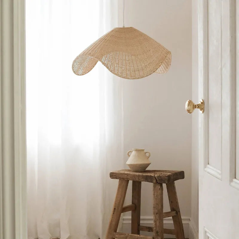 Handmade natural rattan and willow chandelier with warm LED light in three size options.