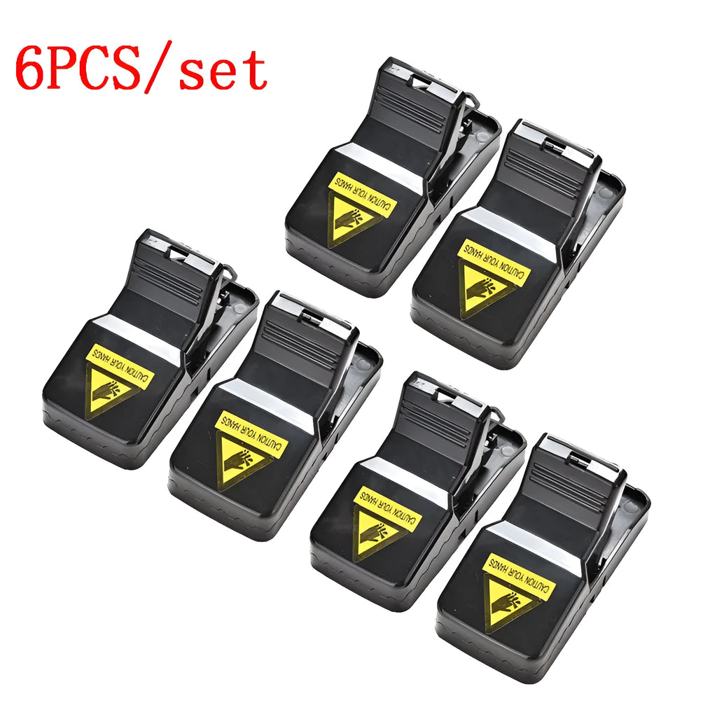 Six black plastic snap mousetraps showing smooth surface and compact size