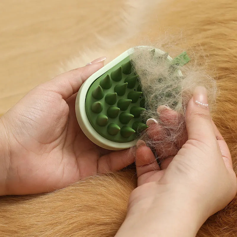 Soft silicone pet hair remover and massage brush for dogs in blue, held in hand.