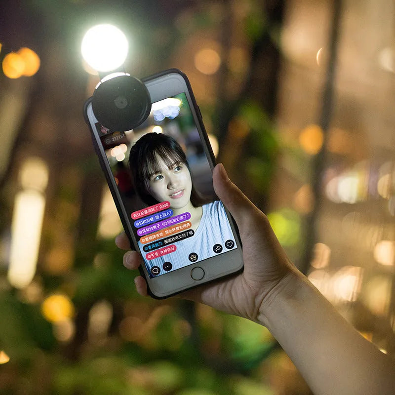 Universal smartphone camera lens kit with wide-angle macro lens and LED ring light in black, red, and silver grey