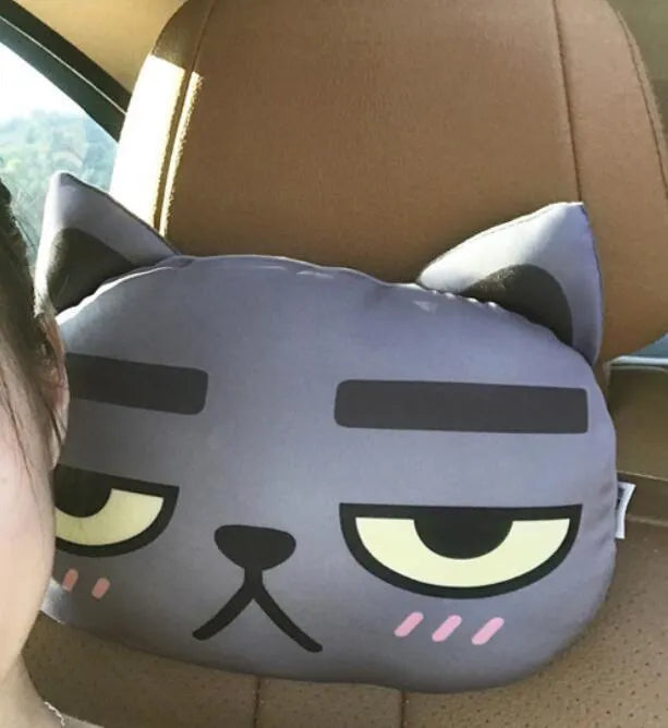 Handmade oblong car headrest pillow with printed cartoon cat design, polyester cotton cover, and PP cotton filling.