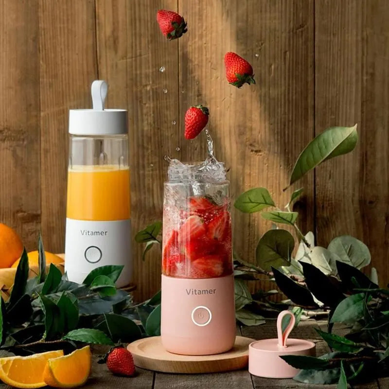 White portable USB rechargeable blender with 350ml cup and silicone handle on a table.