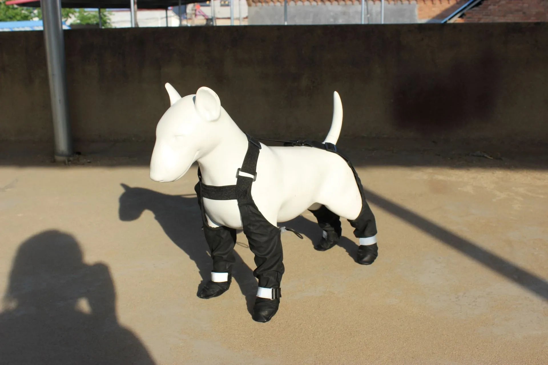 Black waterproof dog shoes with rubber soles and Velcro straps for paw protection